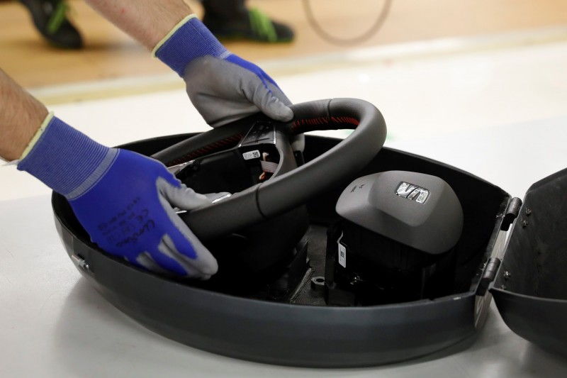 Seat car plant drone delivers steering wheel