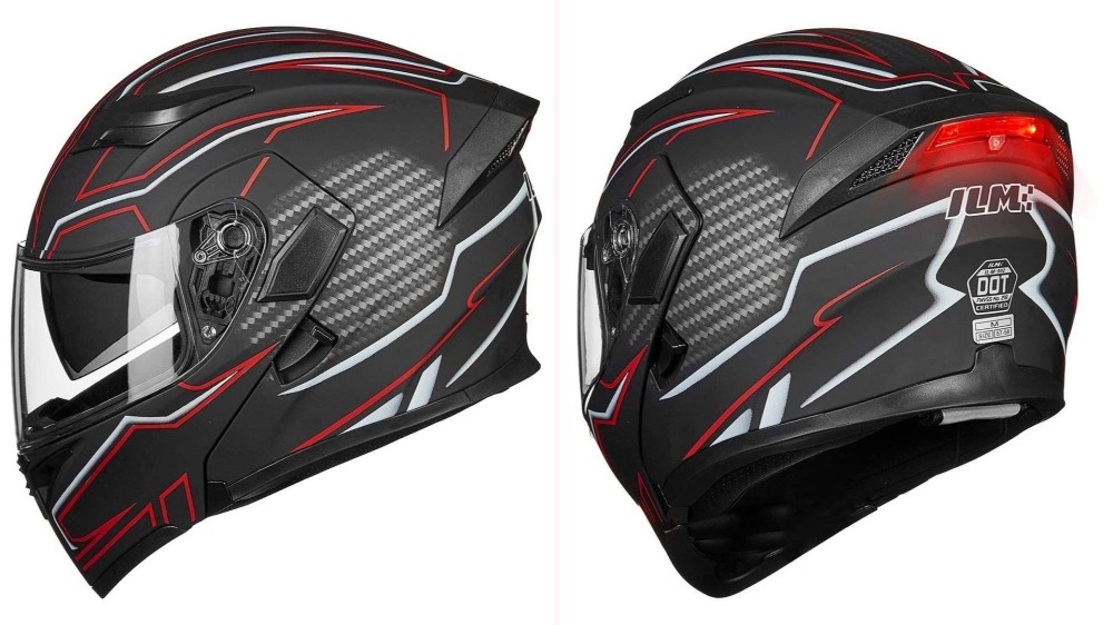 A side and back view of a black full-face helmet with red and white geometric patterns with a red light located on the back of the helmet. 