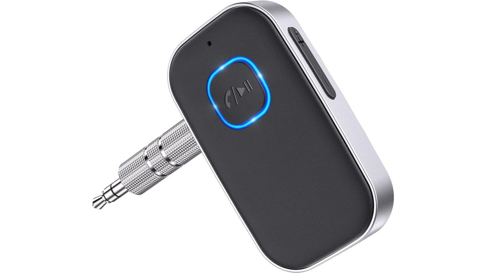 A compact black Bluetooth adapter with an aux jack on the side.