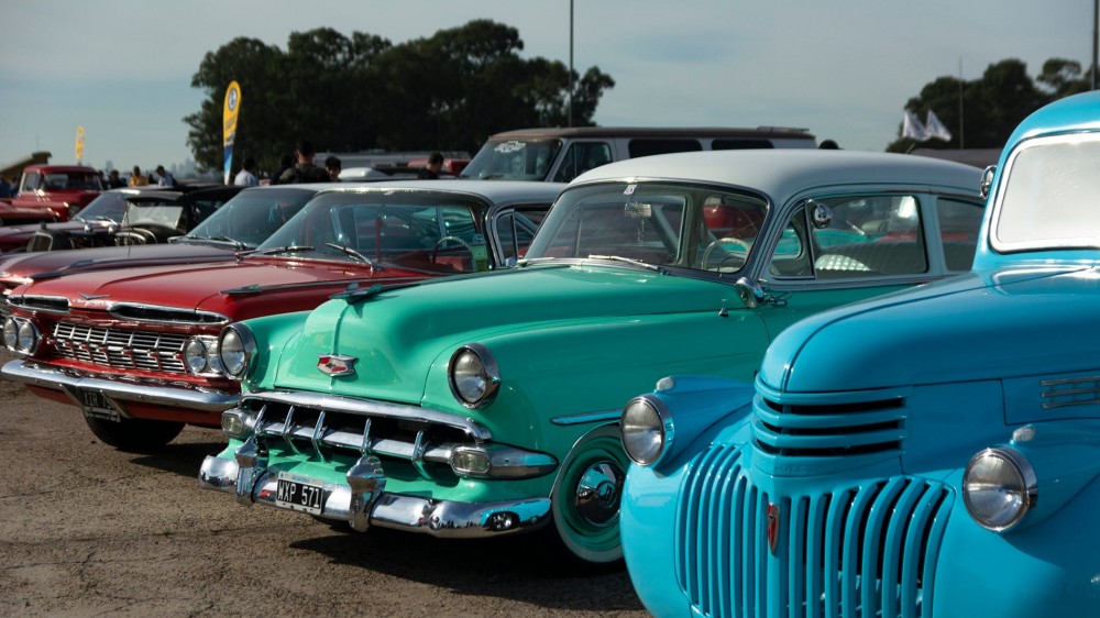 A line of classic cars at a carshow